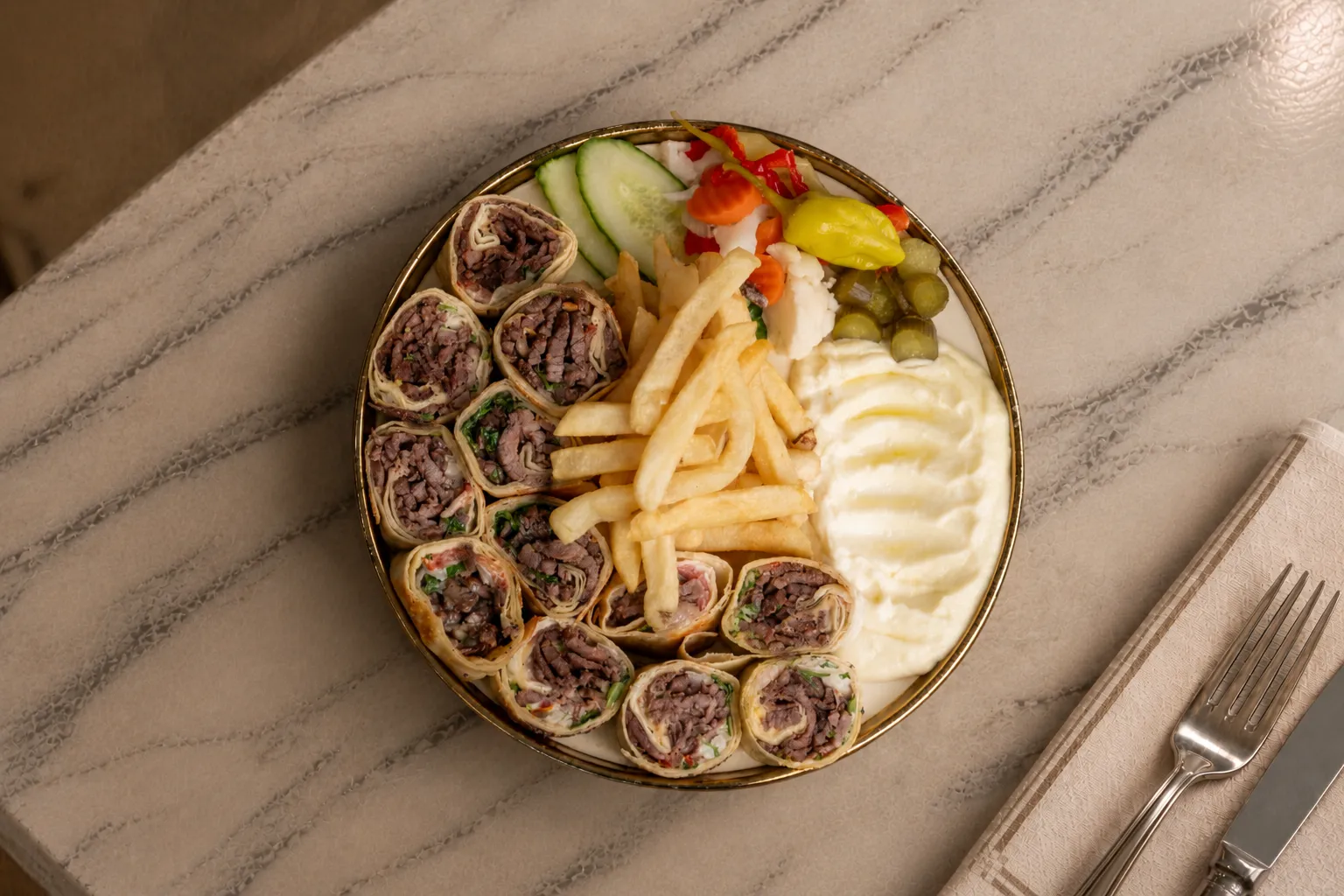 Beef Shawarma Arabi sliced wrap rolls with fries, garlic sauce and pickles